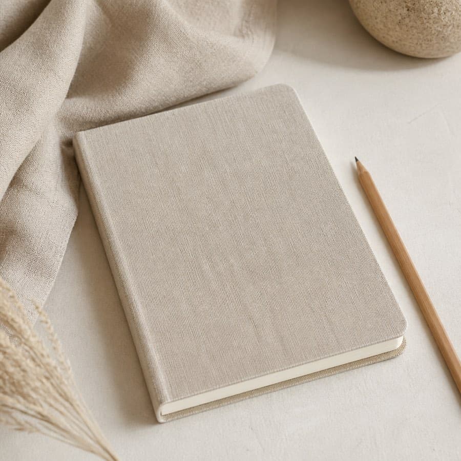 Open notebook with sketches and a pencil